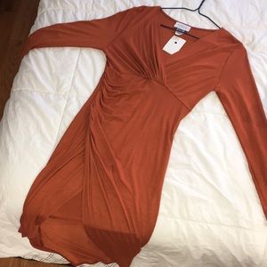 A HOMEGIRL Society body-con dress with a leg slit.